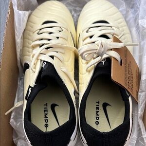 Nike Tiempo Cleats in Cream and Black